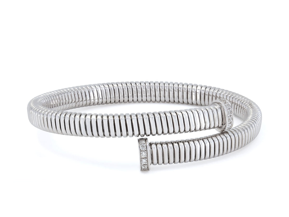 Tubogas bypass bracelet in white gold with diamond set nail terminals