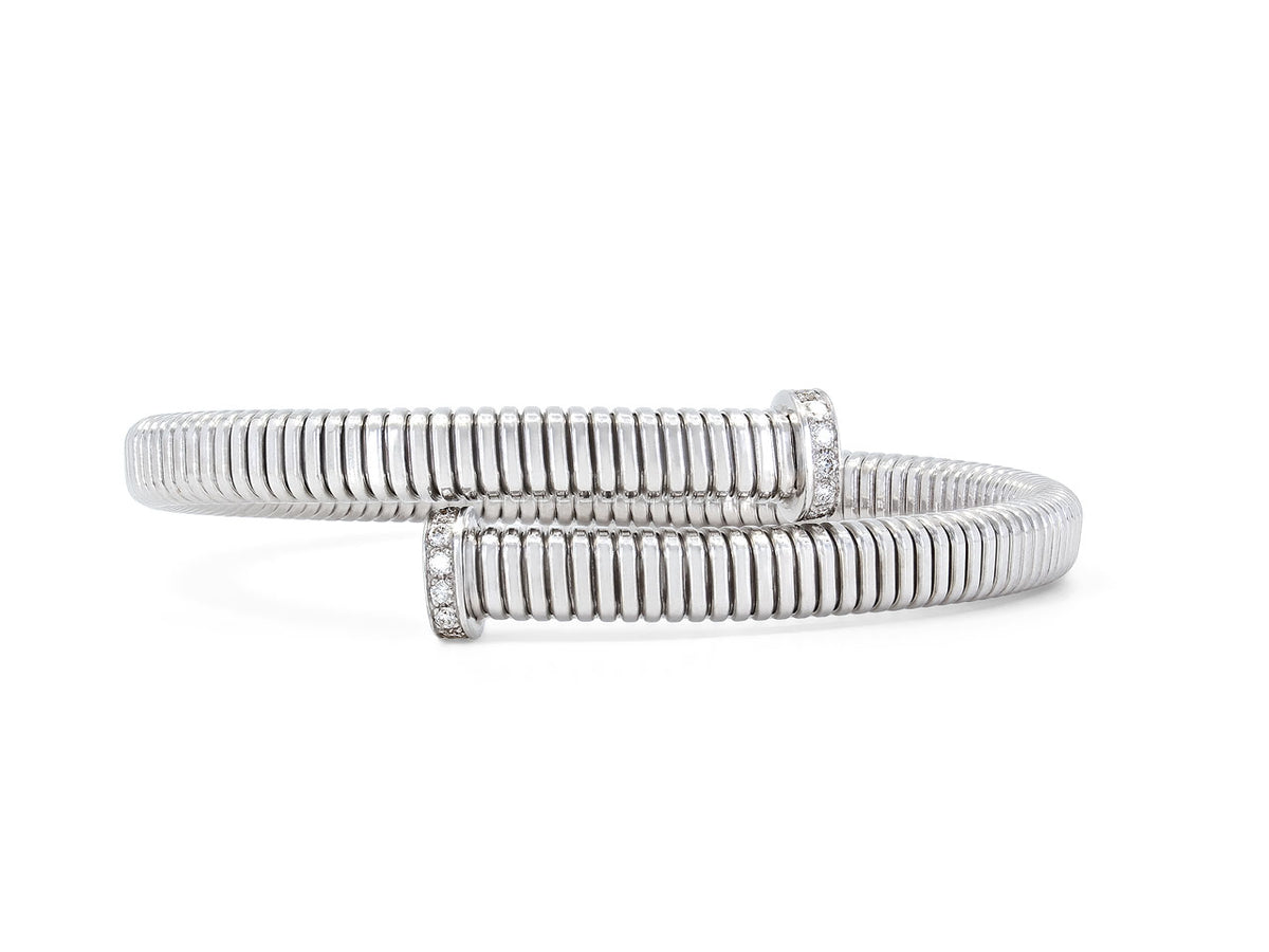 18K white gold tubogas bypass bracelet with diamond terminals