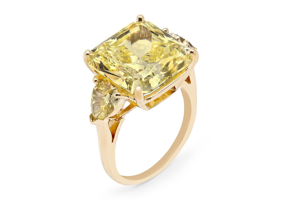 18K gold ring with radiant cut yellow diamond and pear shape side diamonds