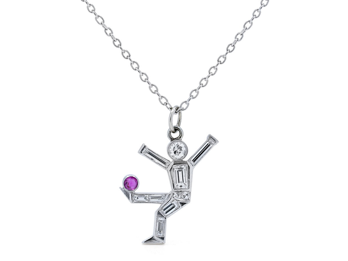 Platinum soccer player pendant with diamonds and ruby