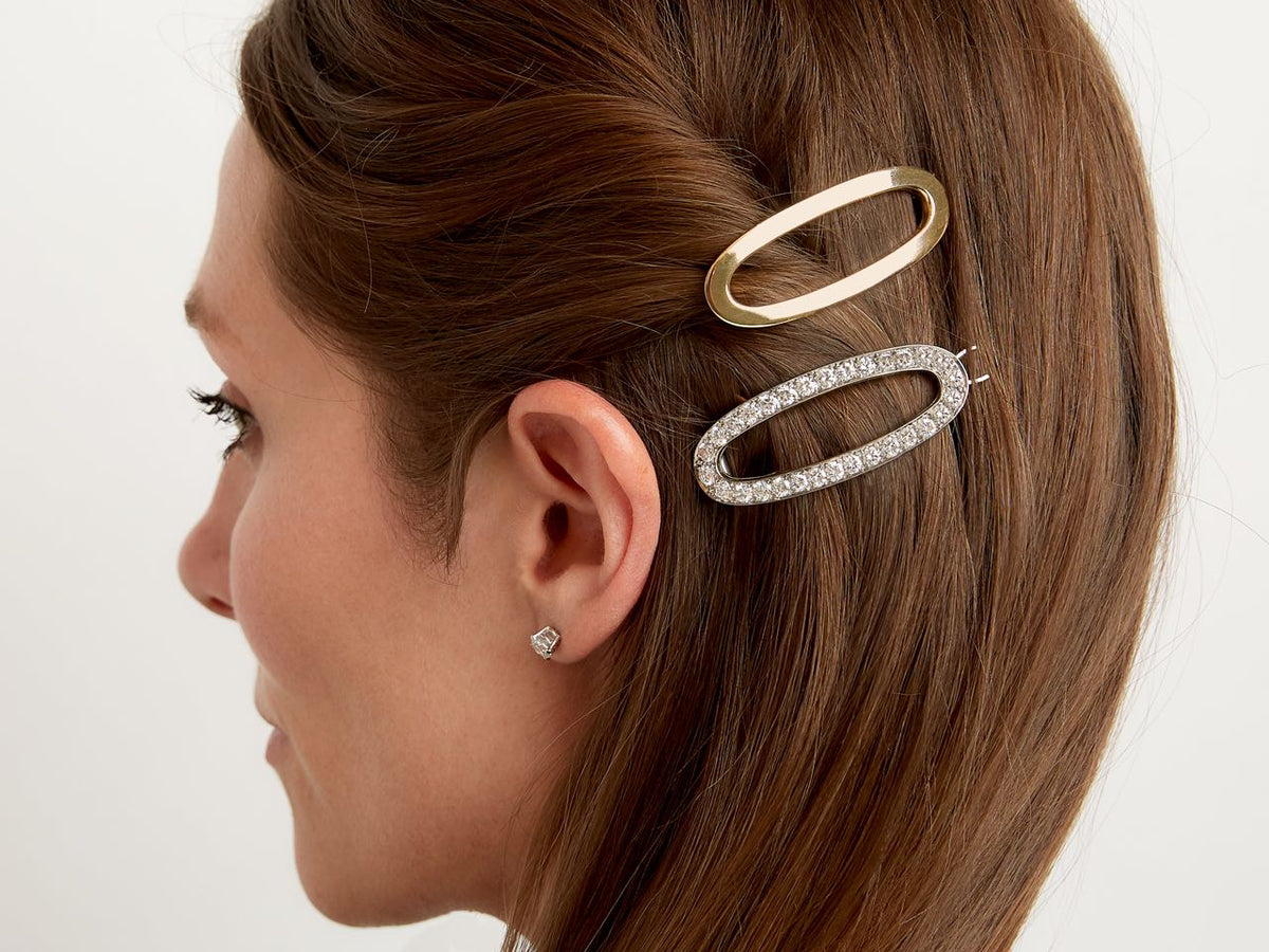 Woman wearing yellow gold and diamond white gold barrettes