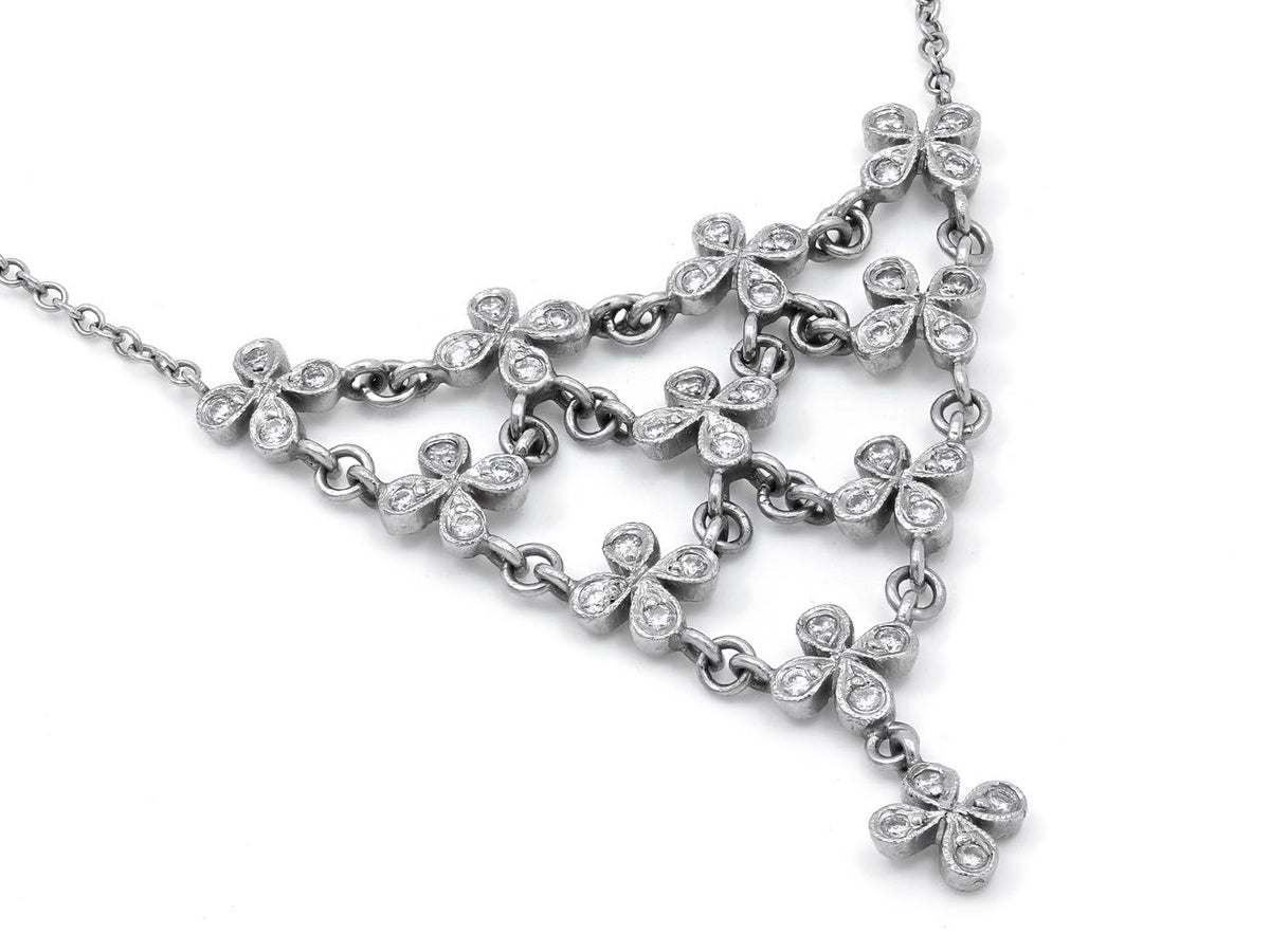 Platinum diamond petal necklace with triangular pendant