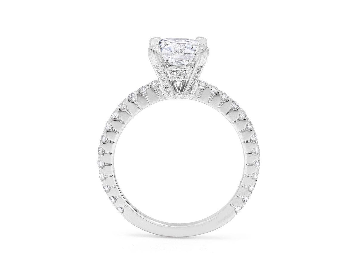 White gold solitaire ring with diamond accented band
