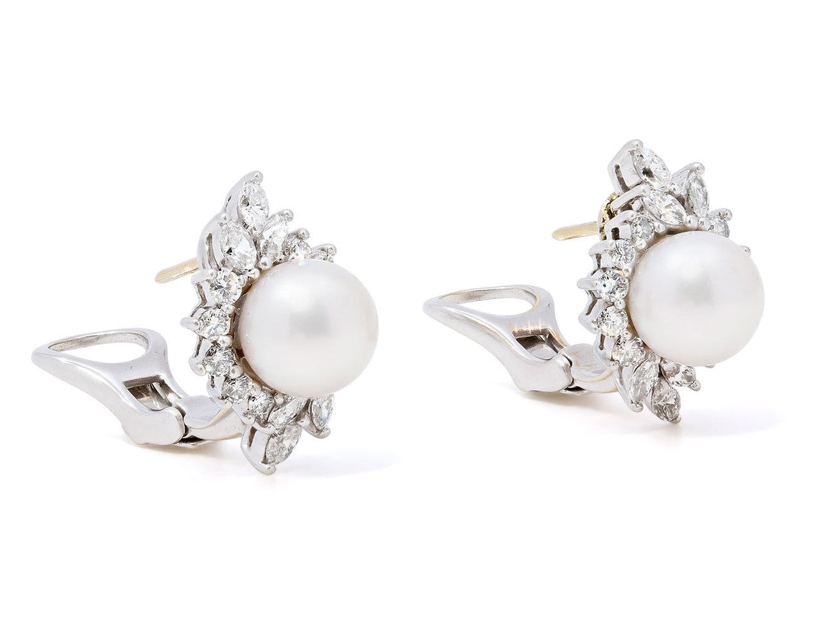 Pair of platinum pearl earrings with diamond surrounds