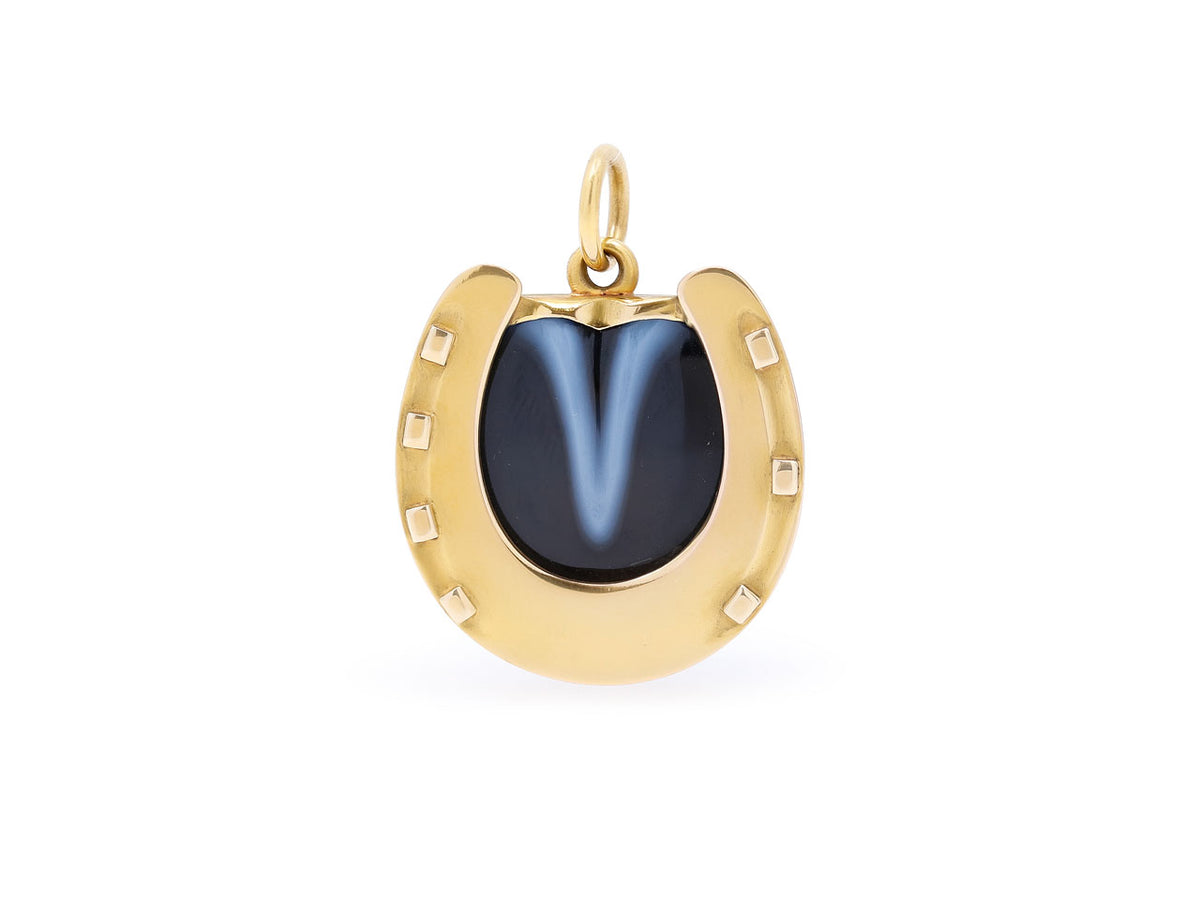 18K gold horseshoe pendant with black banded agate center