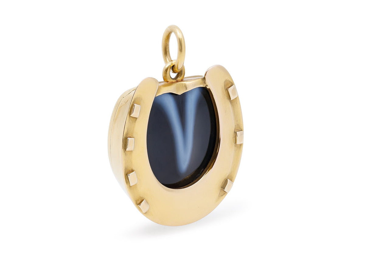 18K gold horseshoe pendant with dark banded agate center