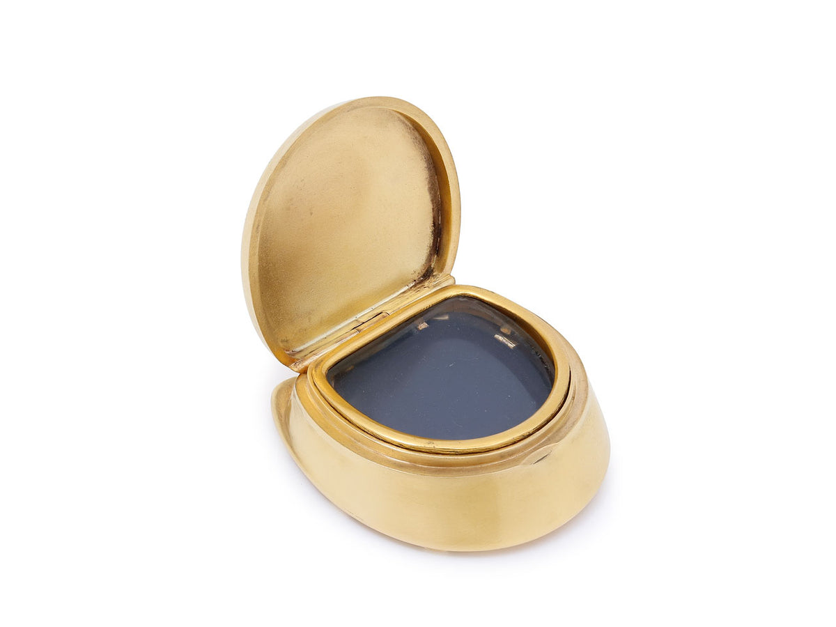 Open 18K gold locket pendant with dark blue inset