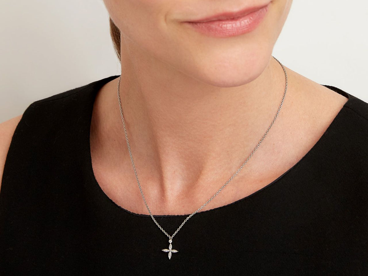 Platinum four petal diamond flower pendant necklace