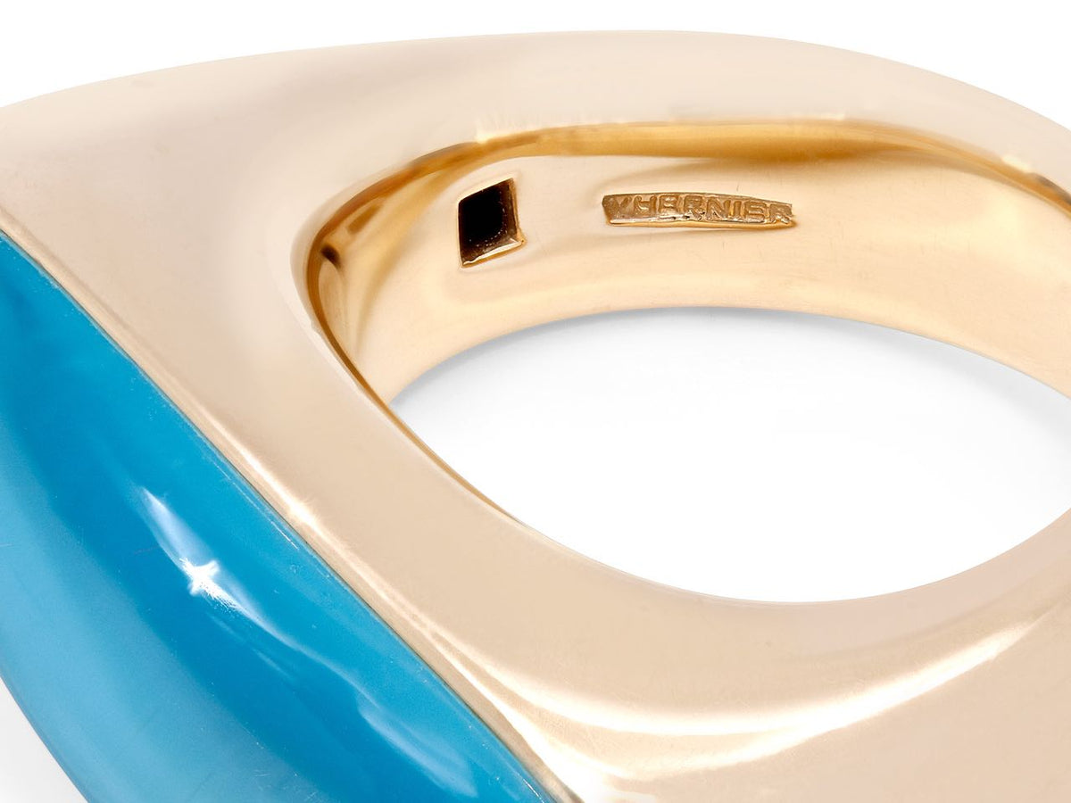 Close view of an 18k gold ring interior with turquoise