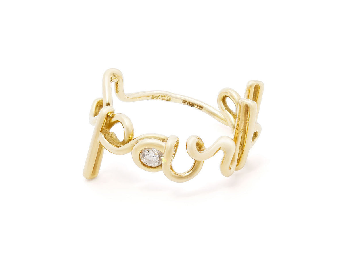 18K gold ring with cursive lettering and diamond accent
