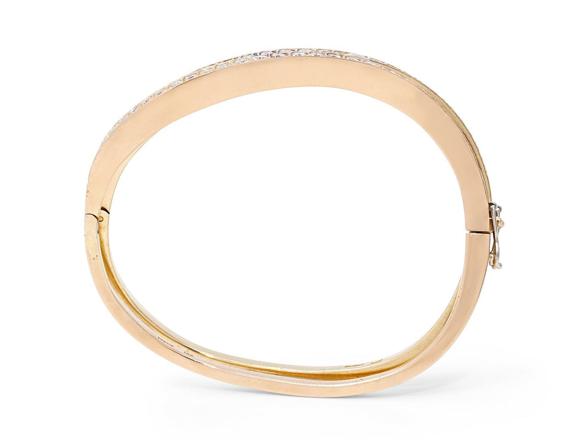 Hinged diamond wave bangle in yellow and rose gold