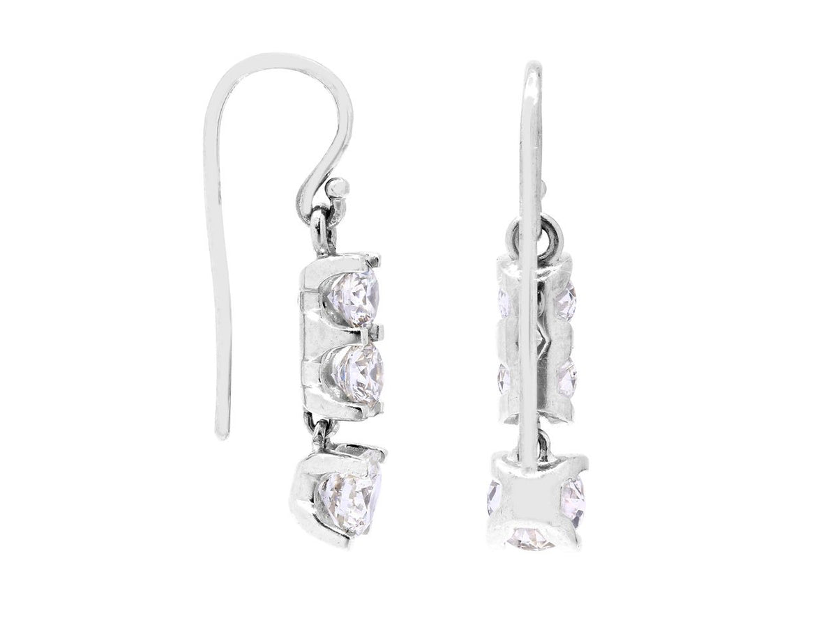 Side view of diamond drop earrings in white gold