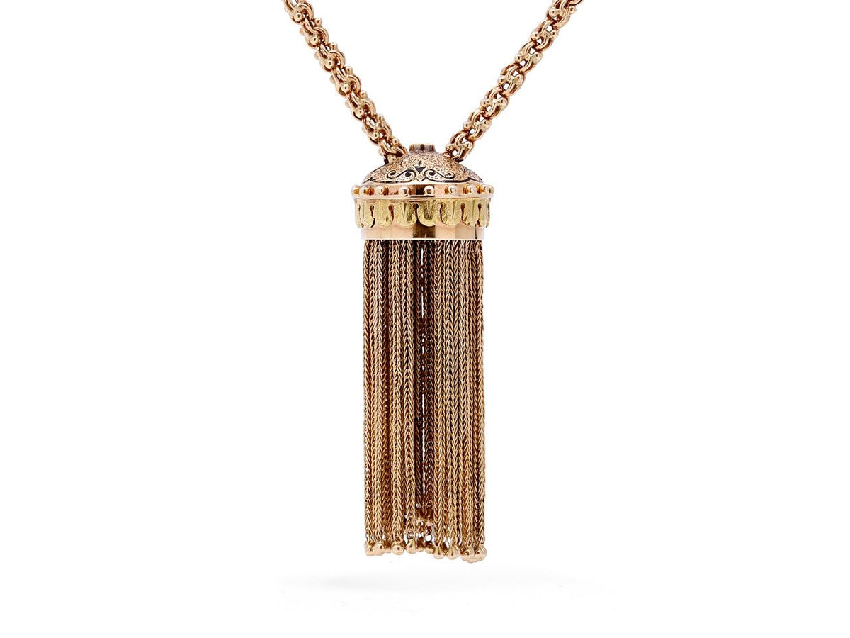 Antique gold tassel pendant necklace with ornate crown