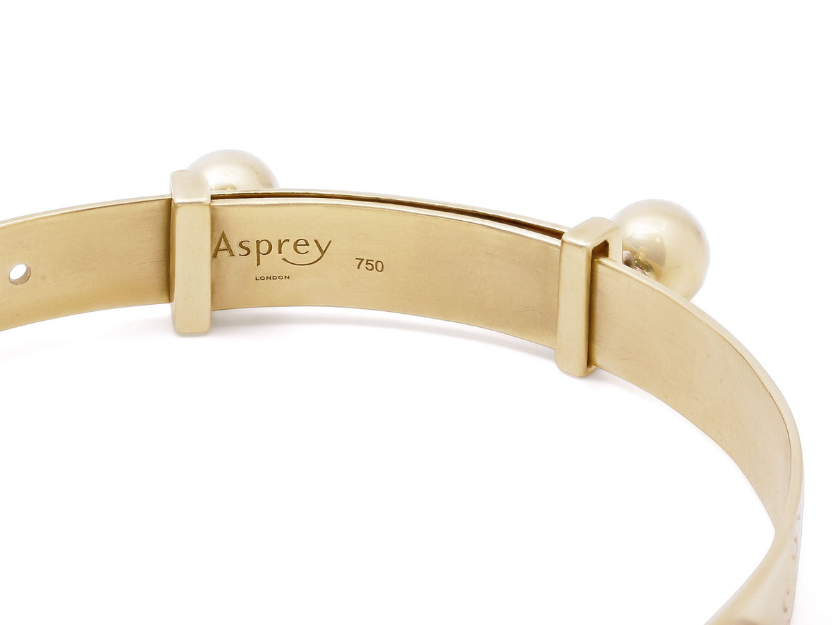 18K gold bangle with Asprey hallmark and bell accents