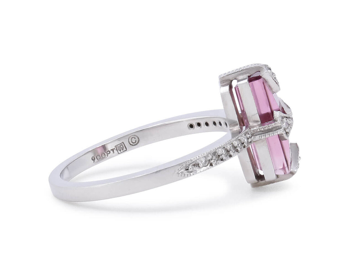 Side view of a platinum ring with pink tourmaline and diamond shoulders