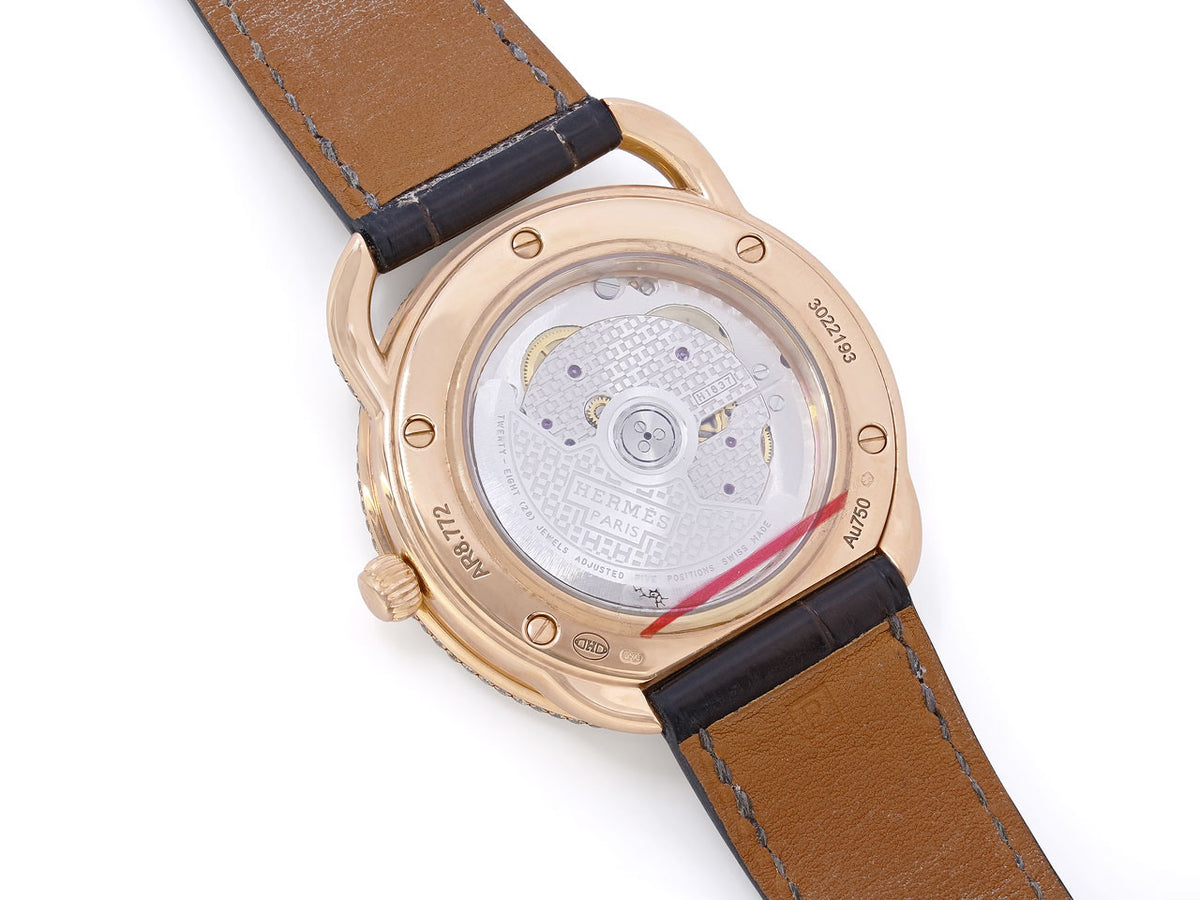 Rose gold Hermès Arceau watch with exhibition case back and brown alligator strap