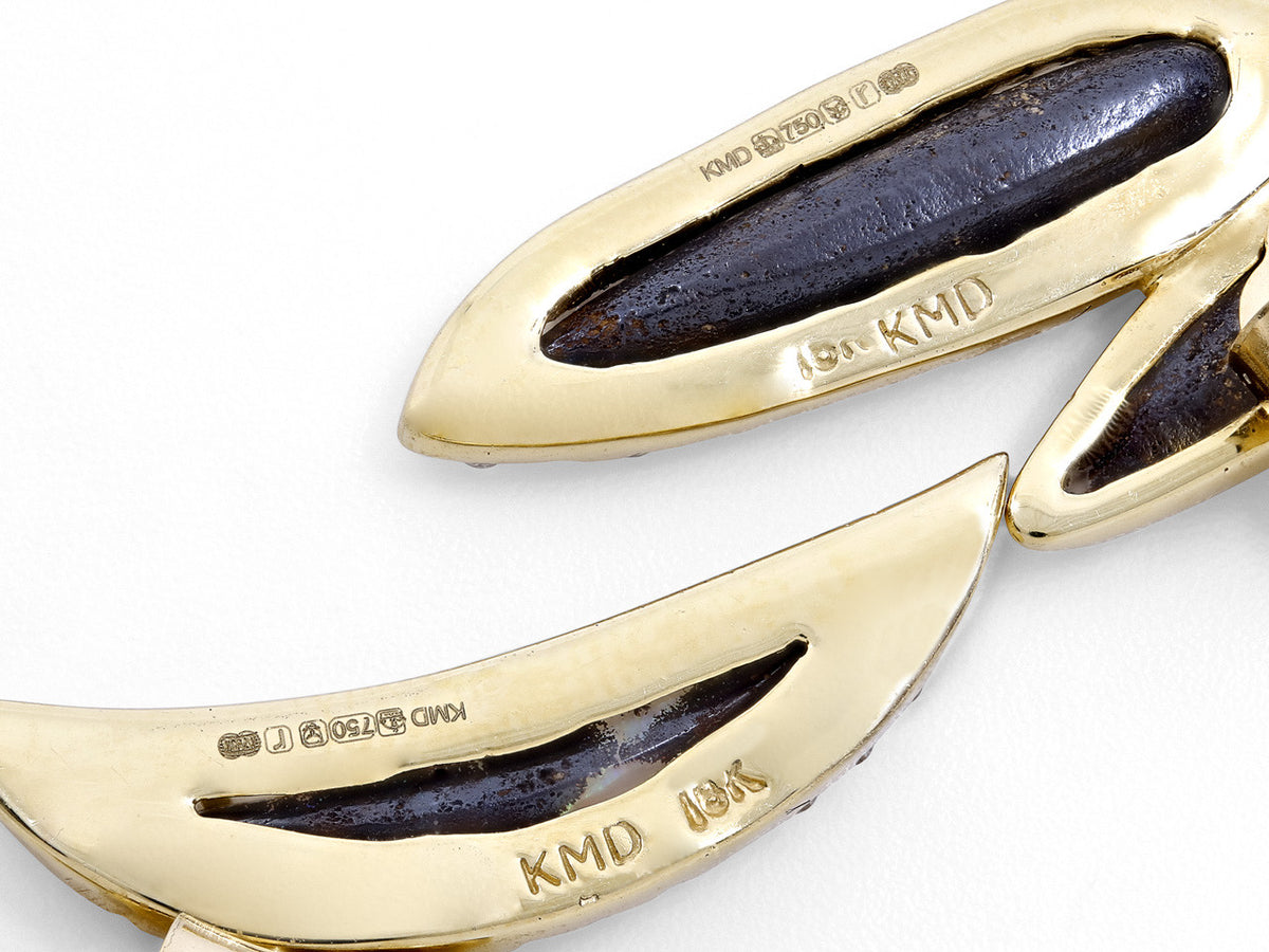Backs of 18K gold opal earrings with KMD hallmarks