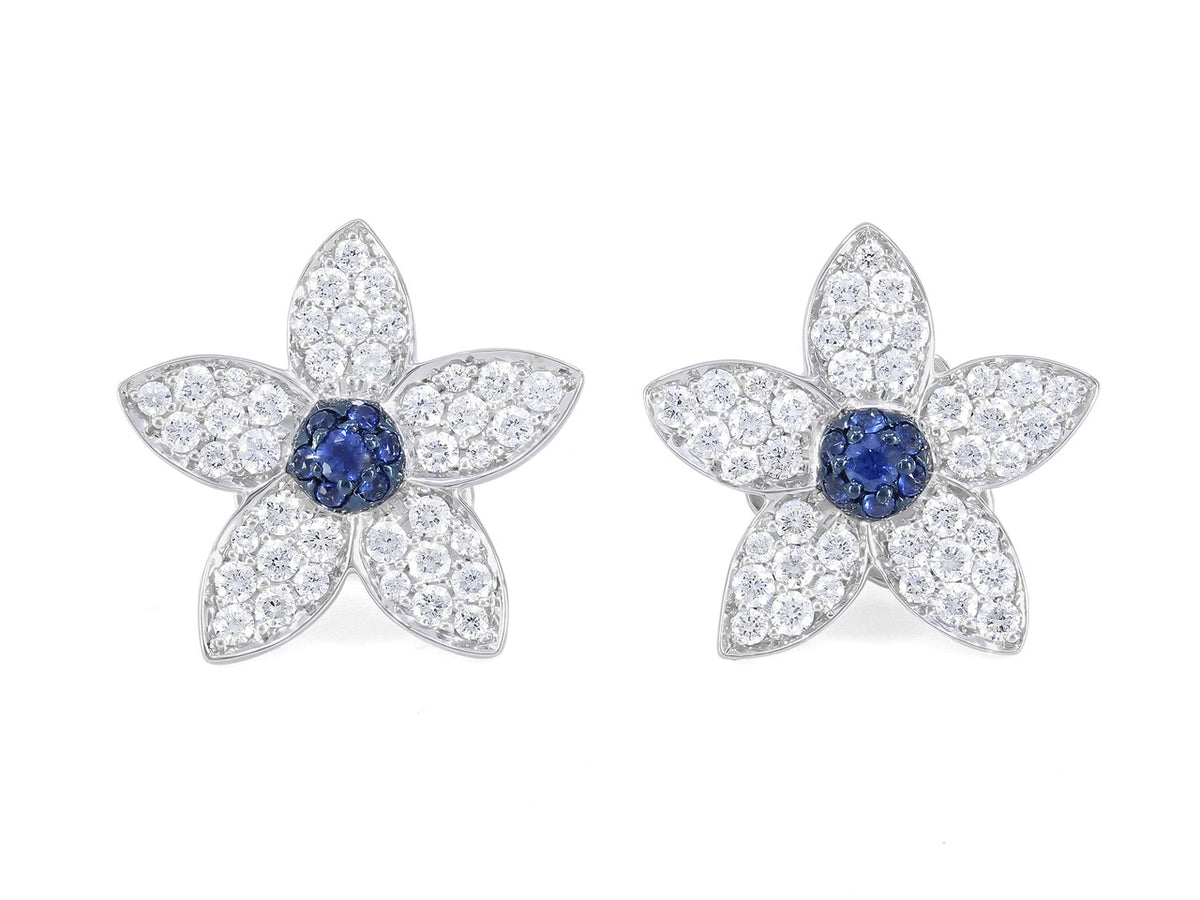 White gold flower earrings with sapphire centers and diamonds