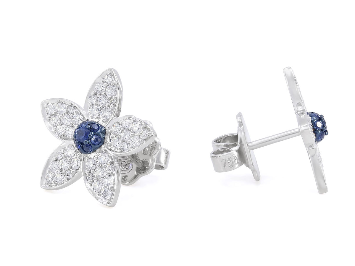 White gold flower earrings with blue sapphire centers