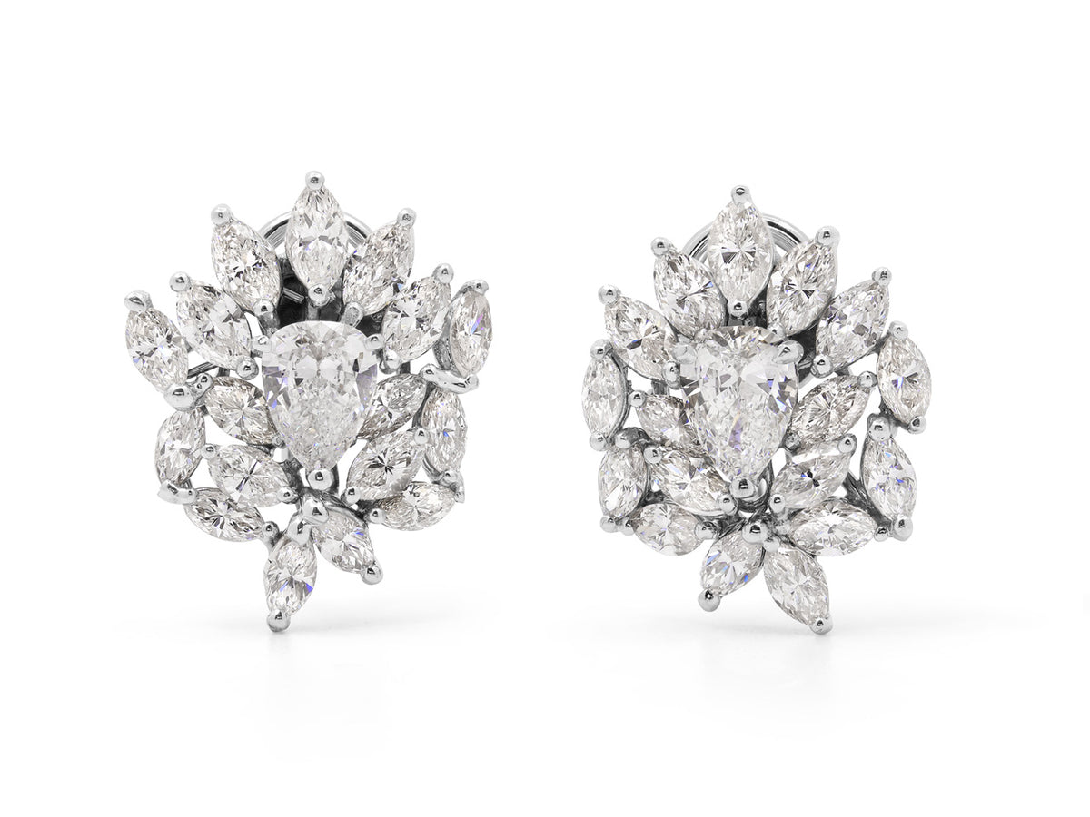 Platinum diamond cluster earrings with pear cut centers