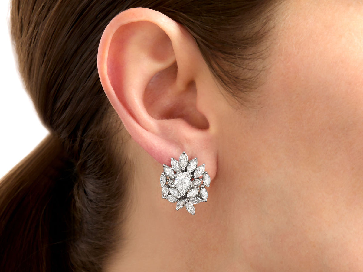 Pear and marquise diamond cluster earring worn on ear