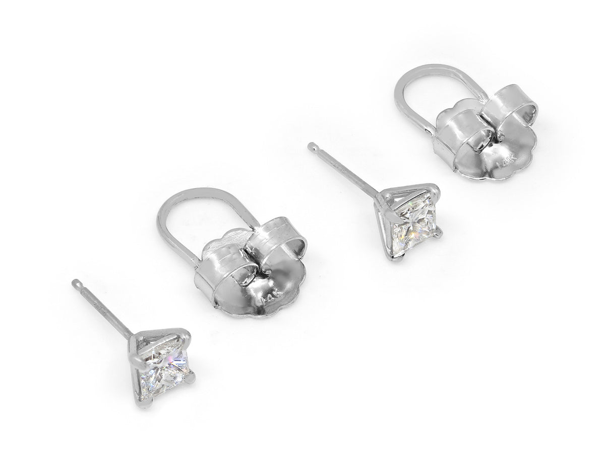 Pair of platinum princess cut diamond stud earrings