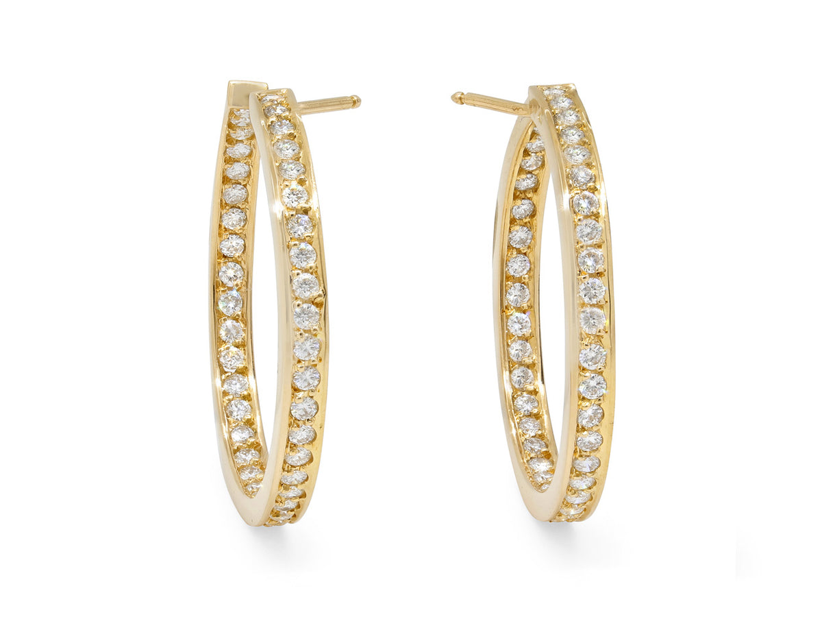 Pair of 18K gold hoop earrings with round diamonds