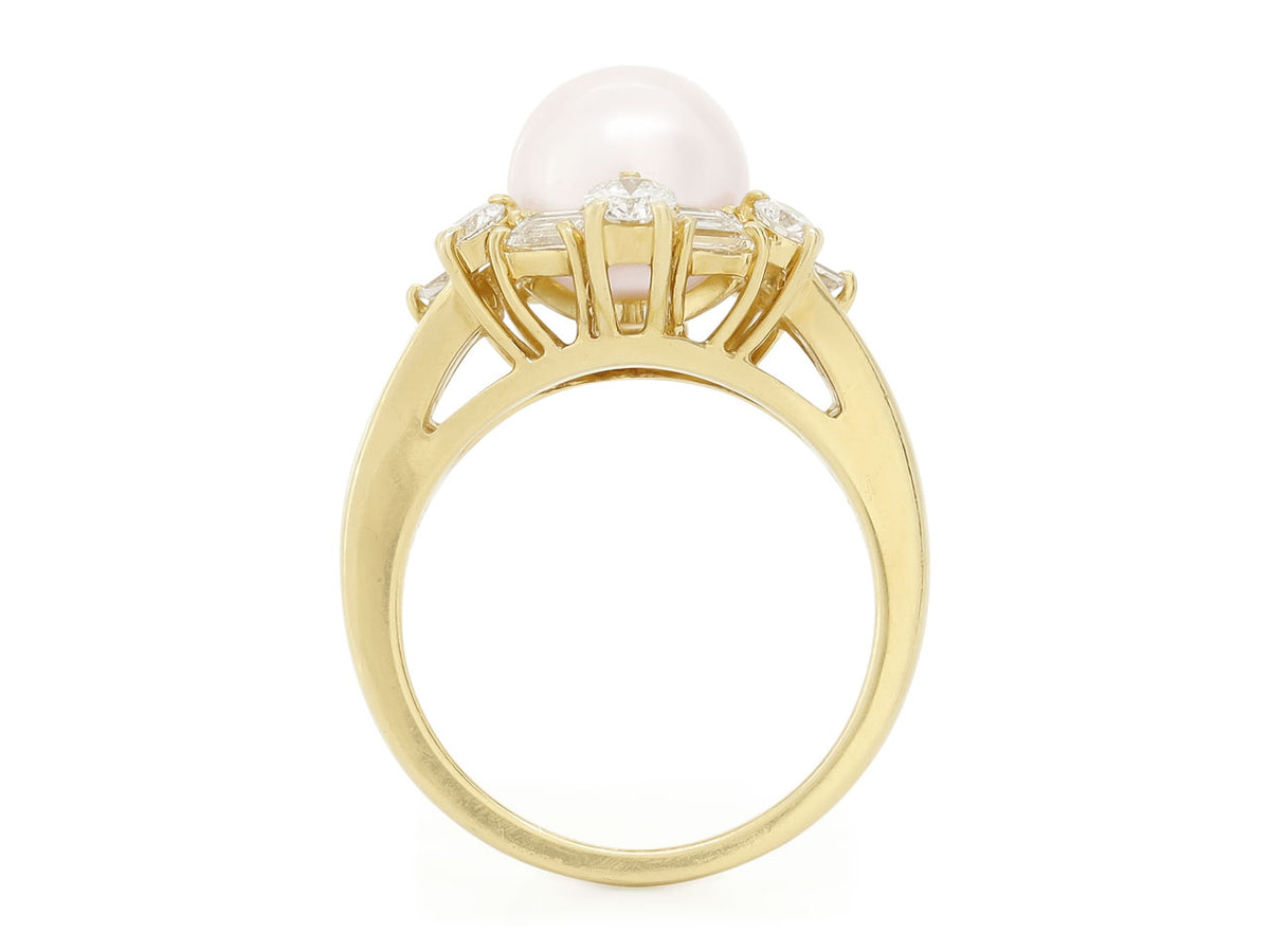 Side view of an 18K yellow gold pearl and diamond ring
