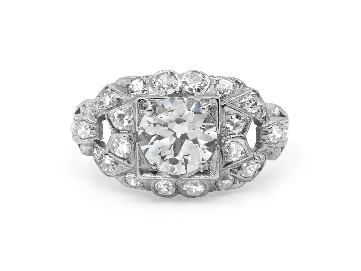 Art Deco platinum ring with central diamond and accents