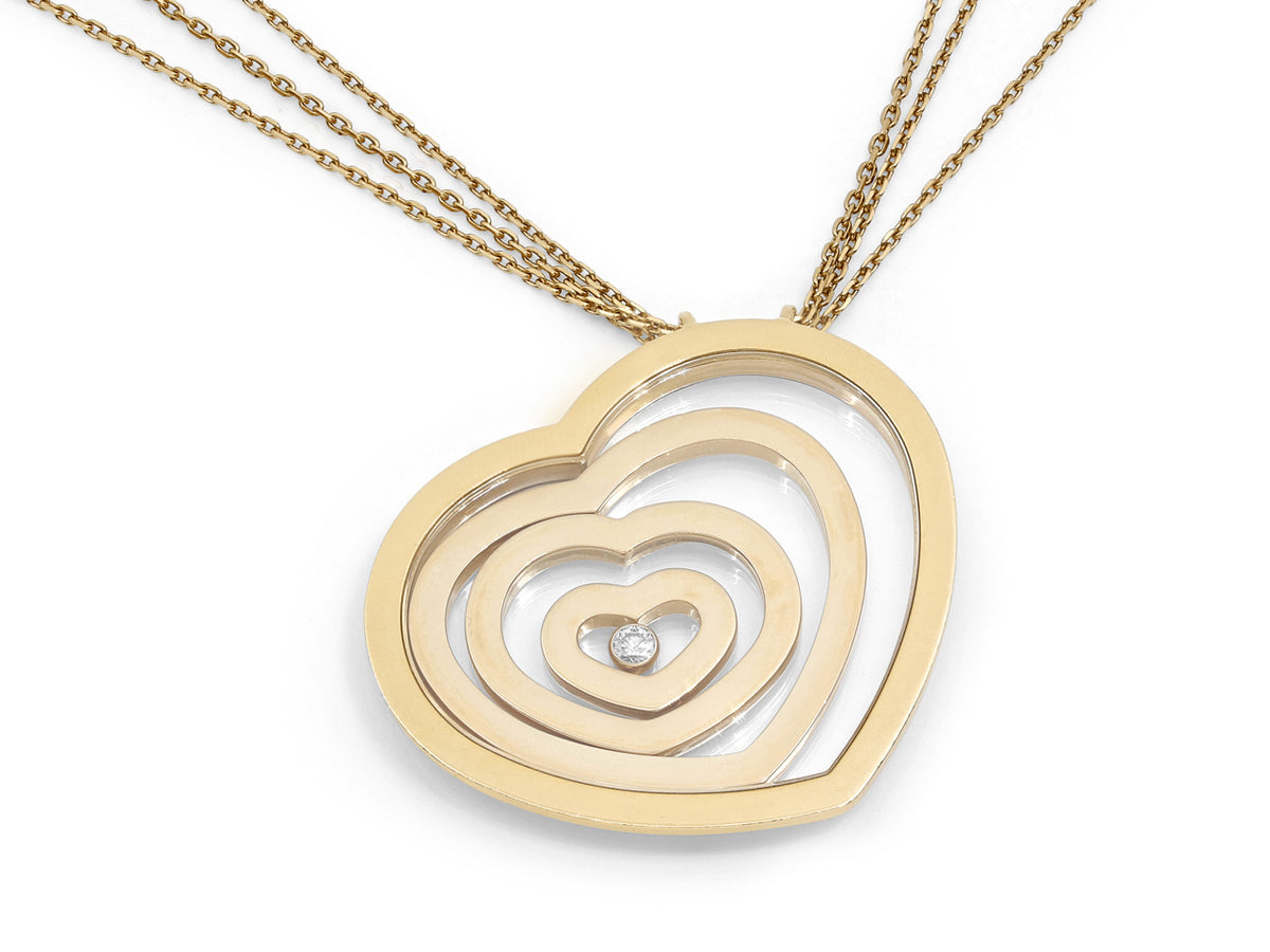 18K gold heart pendant necklace with floating diamond