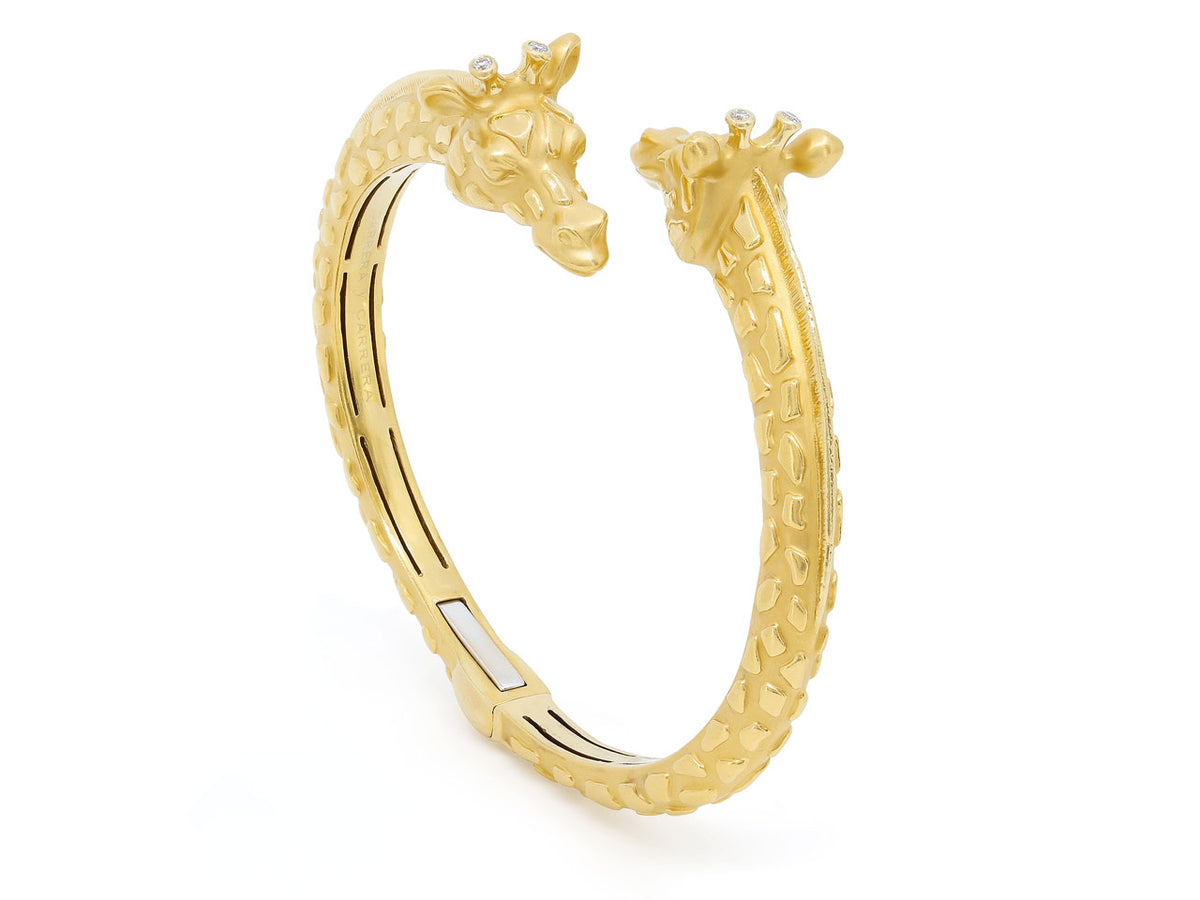Gold bypass bangle with two giraffe heads and diamond accents
