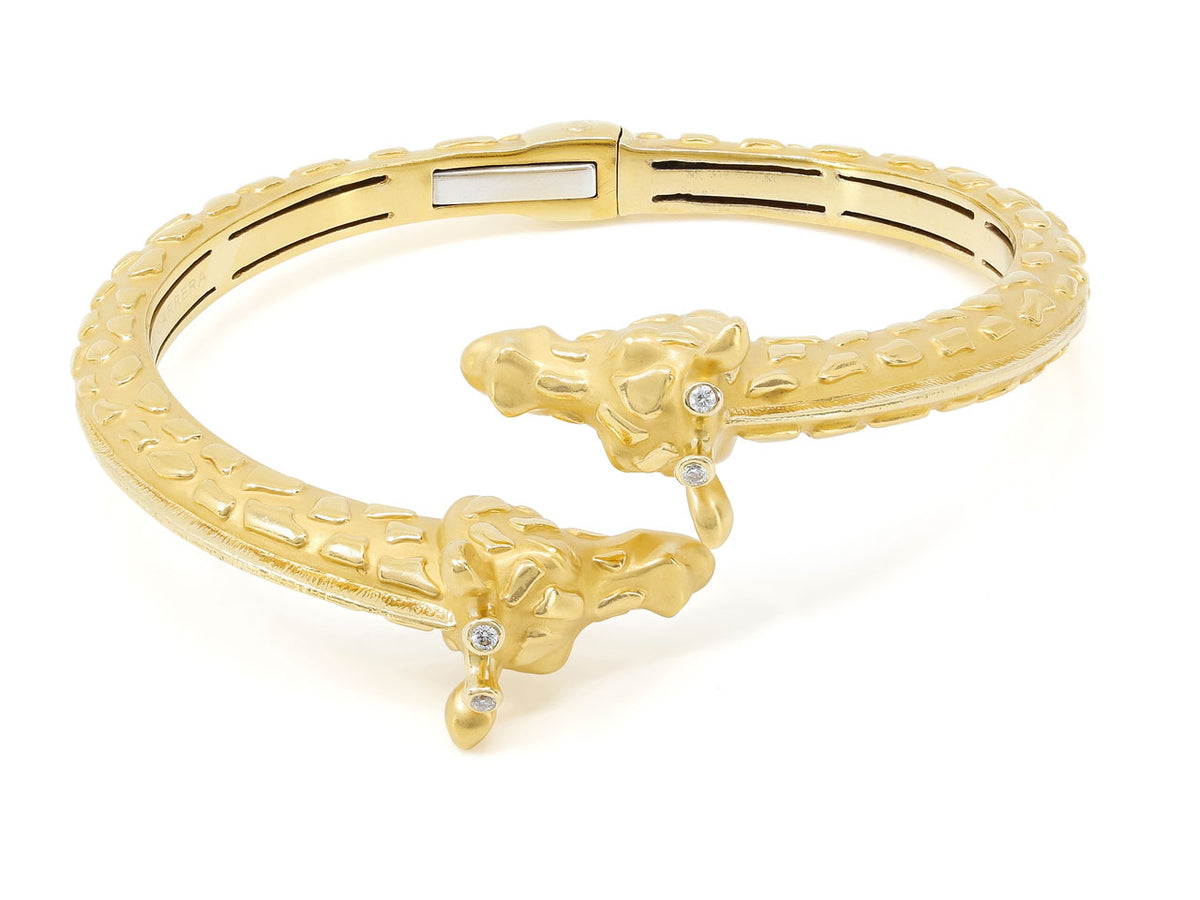 18K gold bypass bangle with giraffe heads and diamonds