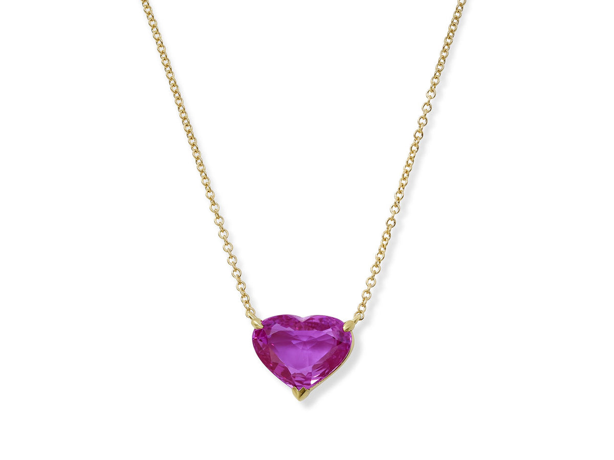 Heart shaped pink sapphire pendant on gold chain