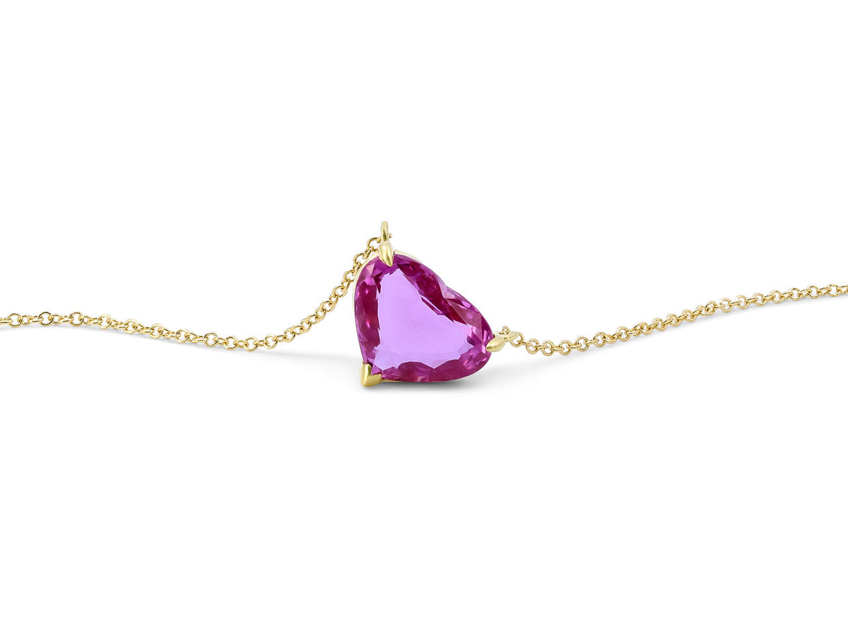 Heart shape pink sapphire pendant on an 18K gold chain
