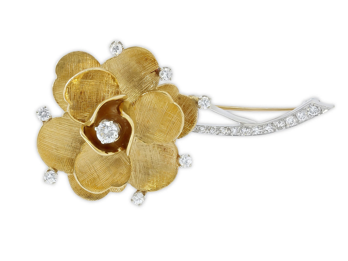 Diamond flower brooch in 18K yellow and white gold