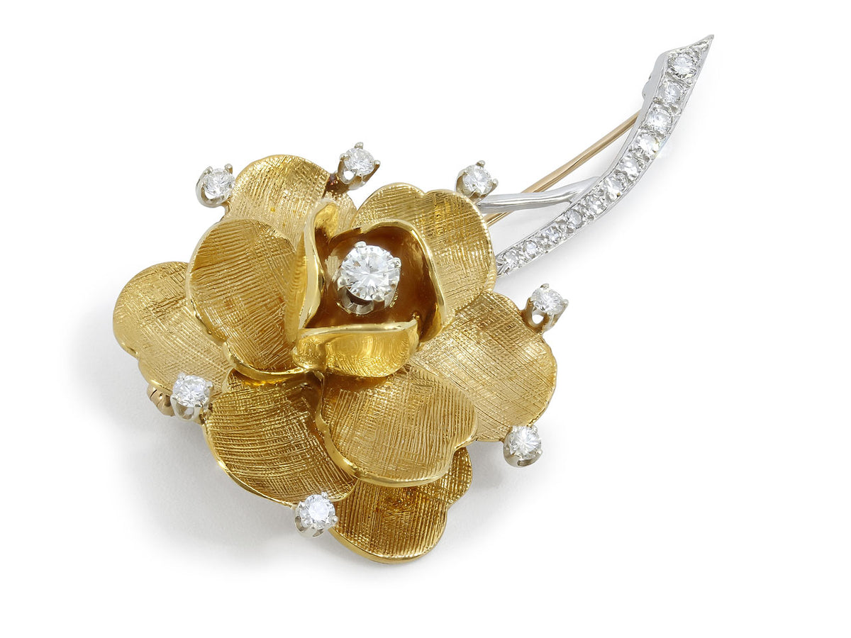 Diamond flower brooch in yellow gold with white gold stem