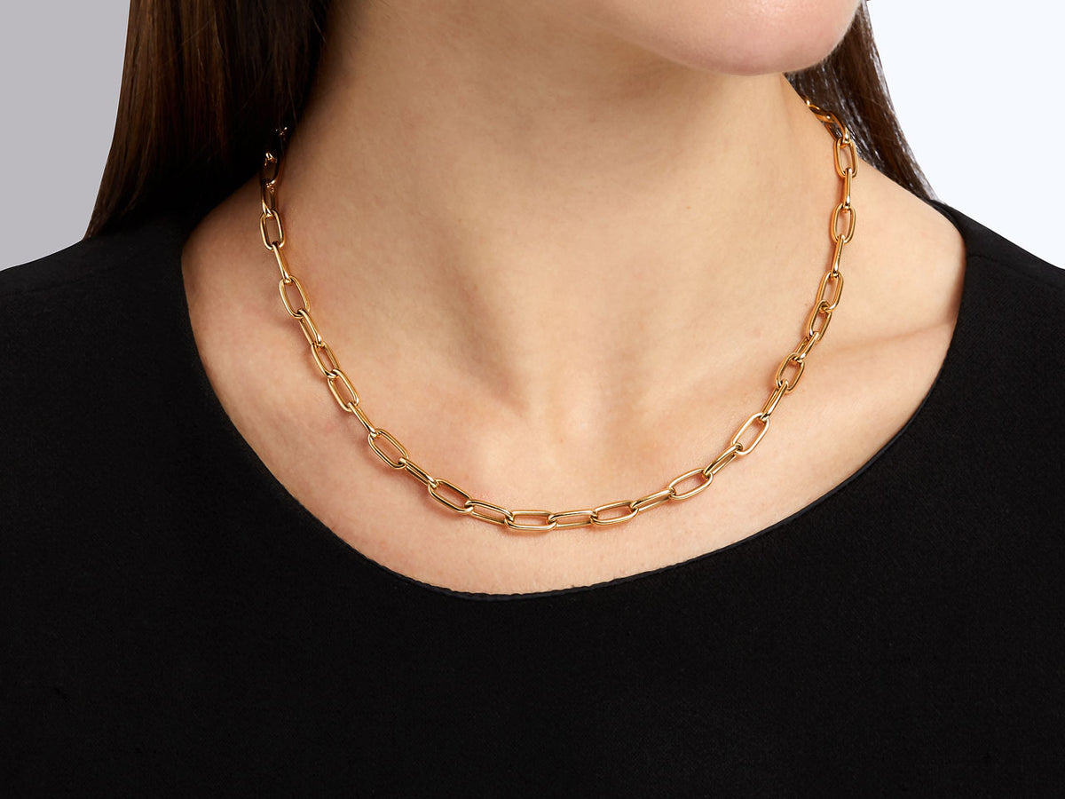 18k gold oval link chain necklace worn on a model
