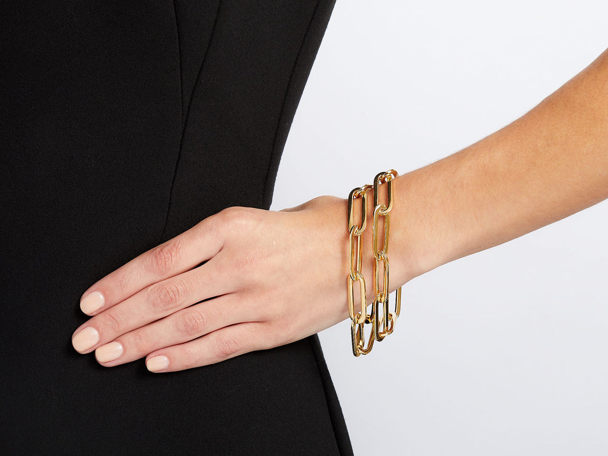 18K gold elongated link bracelet worn on the wrist