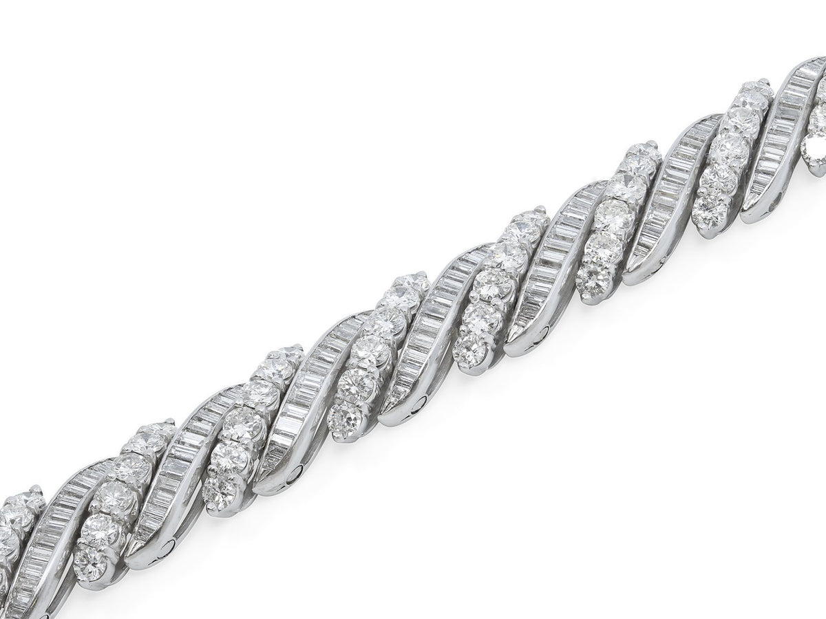 Platinum bracelet with alternating round and baguette diamonds