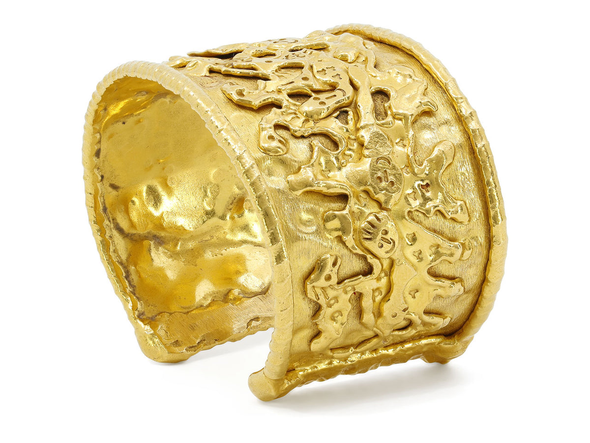 Textured 22K gold cuff with abstract figure motifs