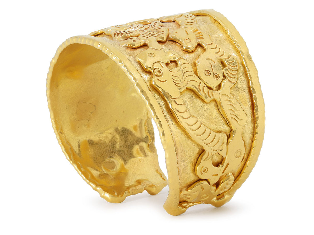 Wide textured 22K gold cuff with abstract figures
