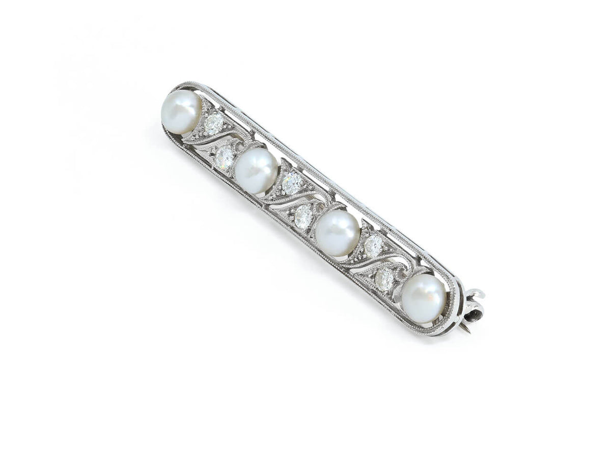 Platinum bar brooch with four pearls and diamonds