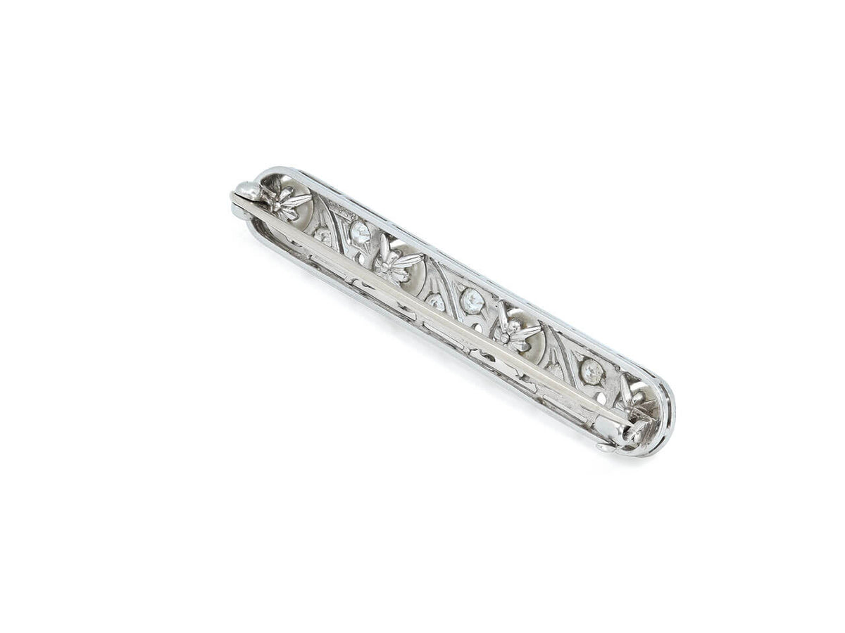 Platinum bar brooch with natural pearls and diamond scrollwork