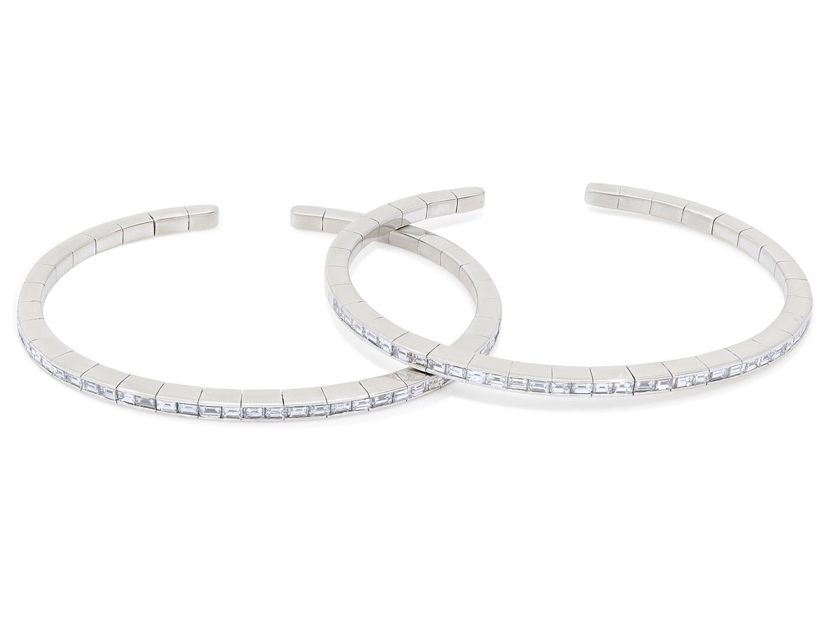 Pair of flexible white gold bangles with baguette diamonds
