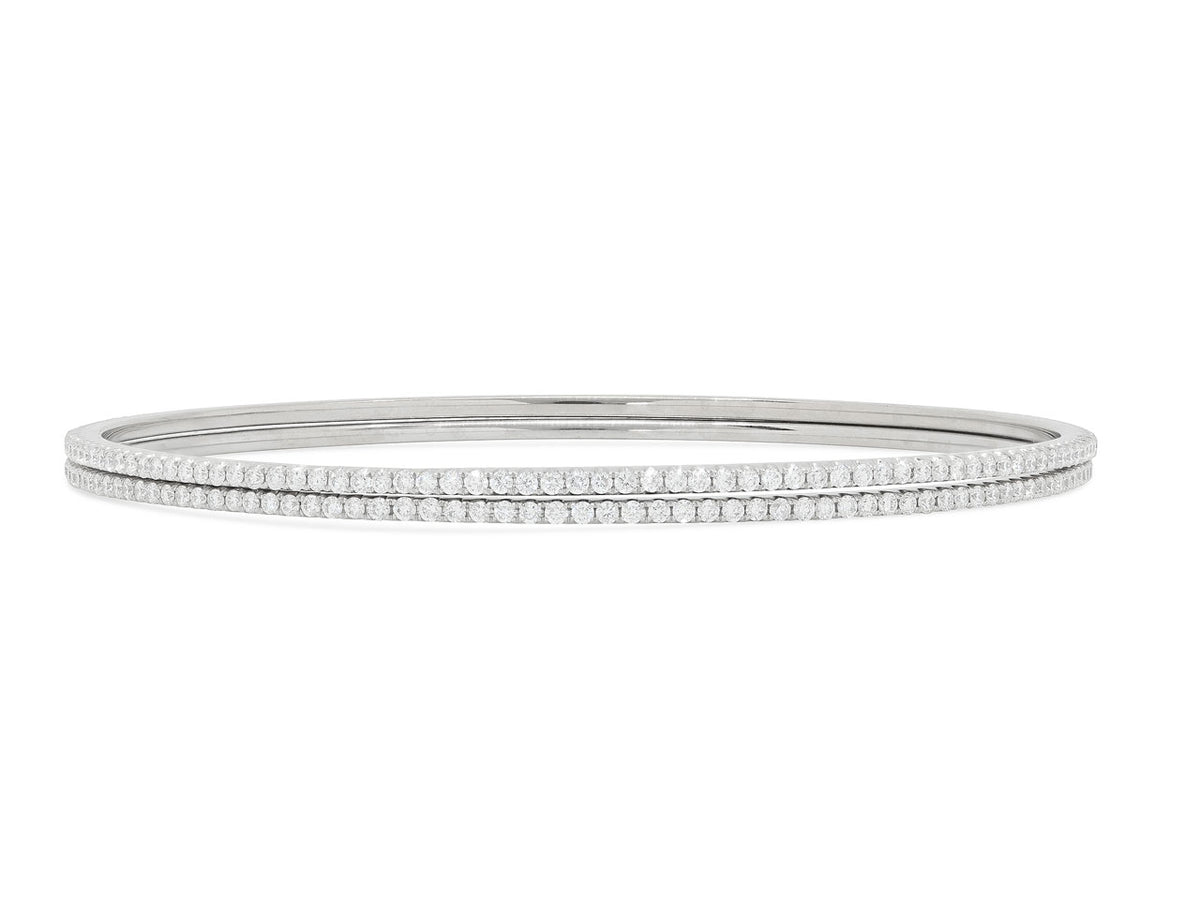 Pair of diamond bangles in 18K white gold
