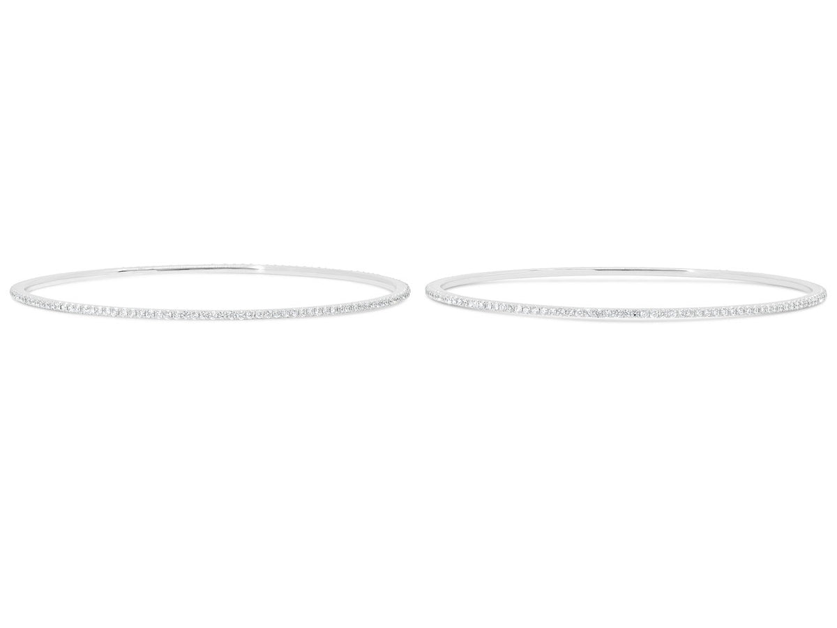 Pair of diamond bangles in 18K white gold