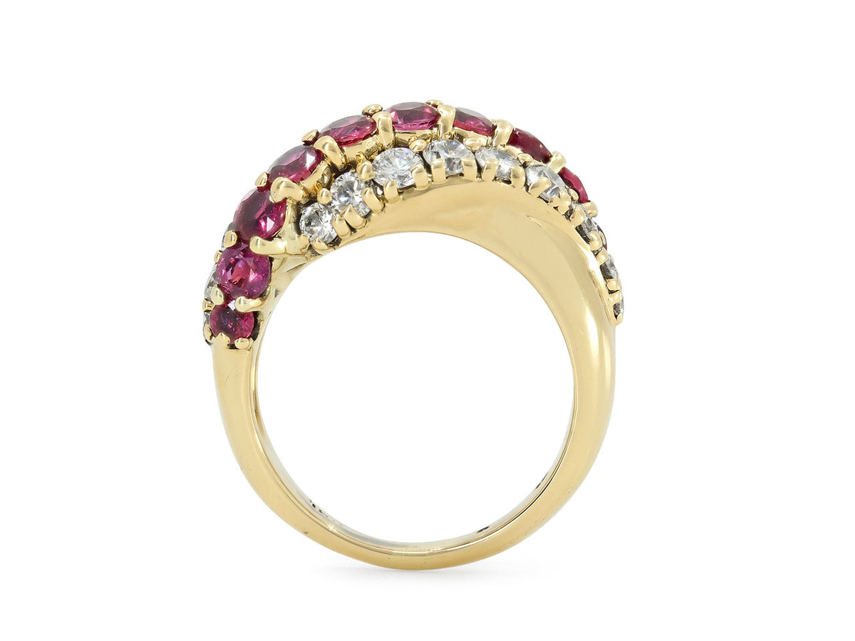 Side view of a yellow gold ring with ruby and diamond rows