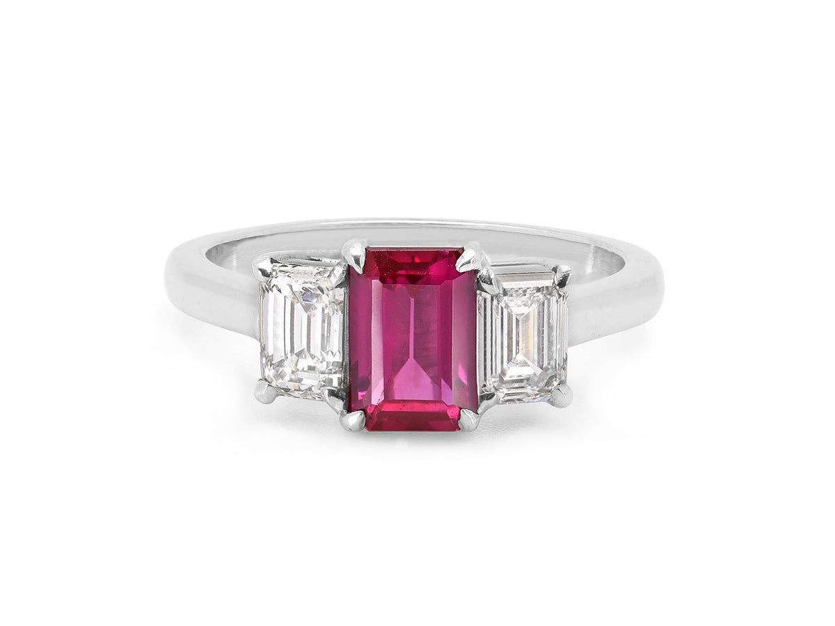 Platinum ring with a ruby and two emerald cut diamonds