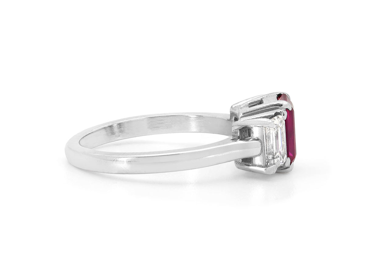 Side view of platinum ring with ruby and emerald cut diamond