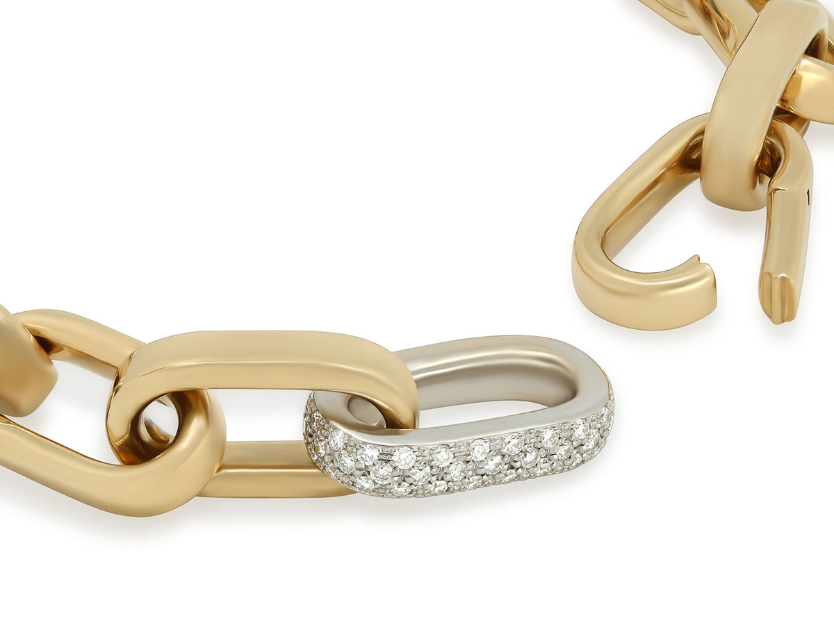 Close-up of an 18K gold bracelet with diamond link